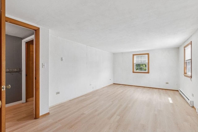 32 Cambo St, Brockton, MA 02301 - spare room with a baseboard heating unit, light wood-style floors, and healthy amount of natural light