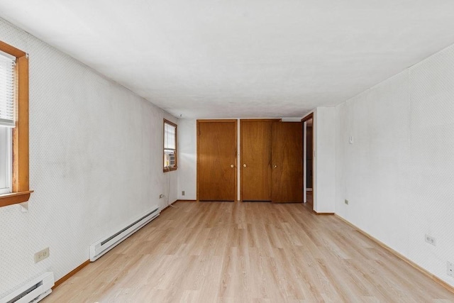 32 Cambo St, Brockton, MA 02301 - unfurnished bedroom with a baseboard radiator, light wood-type flooring, and cooling unit