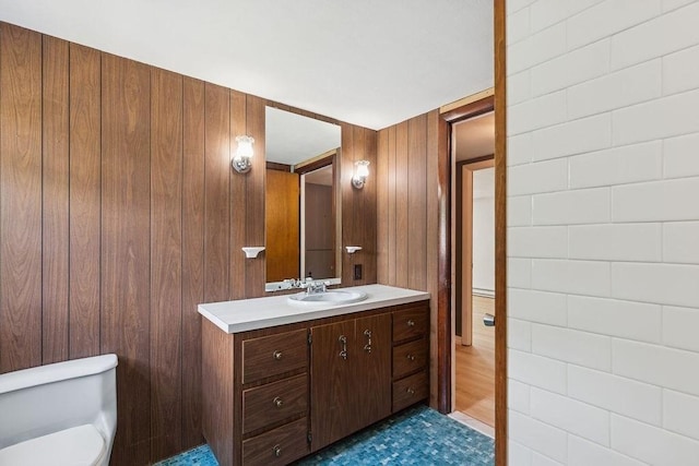 32 Cambo St, Brockton, MA 02301 - half bath featuring vanity, wood walls, and a baseboard radiator