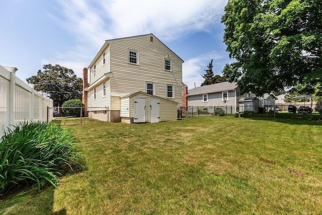 32 Cambo St, Brockton, MA 02301 - rear view of property with a storage shed and a fenced backyard
