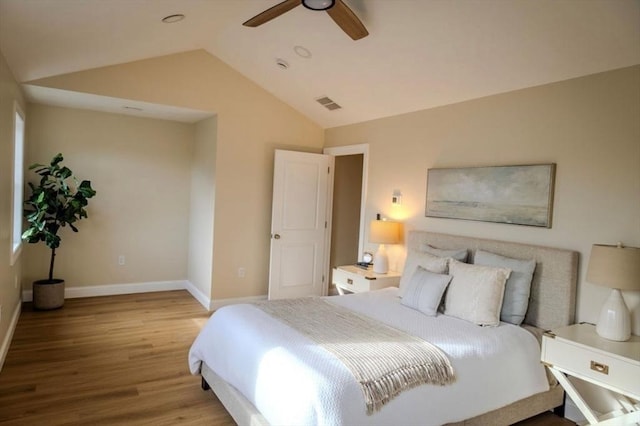 bedroom featuring lofted ceiling, hardwood / wood-style flooring, and ceiling fan