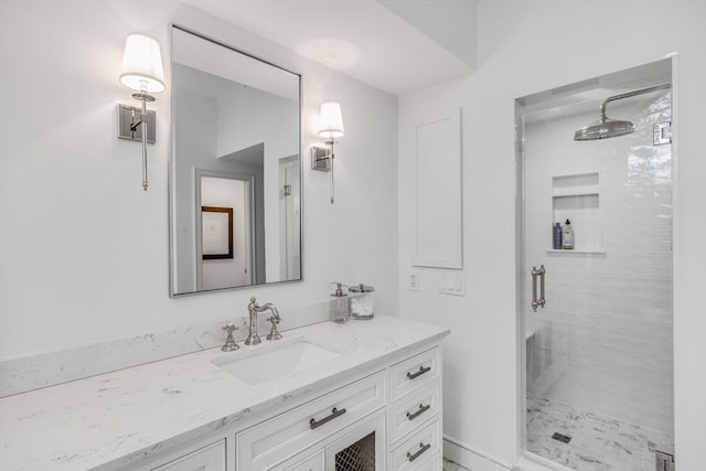 full bath featuring a shower stall and vanity