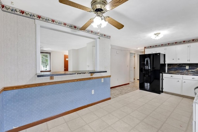 49 Bamforth Rd, Springfield, MA 01128 - kitchen featuring black fridge, ceiling fan, light flooring, wallpapered walls, and white cabinets