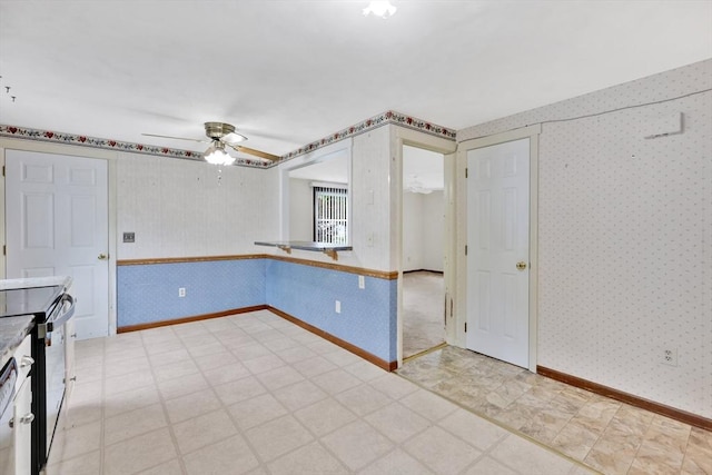 49 Bamforth Rd, Springfield, MA 01128 - unfurnished room featuring wallpapered walls, light flooring, and ceiling fan