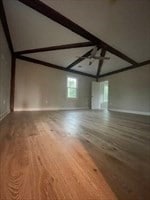 unfurnished living room with hardwood / wood-style floors