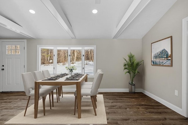 dining room with vaulted ceiling with beams, baseboards, and wood finished floors