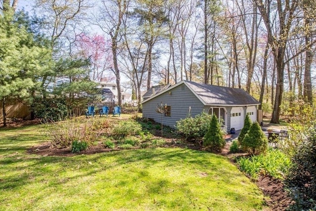 exterior space with a detached garage