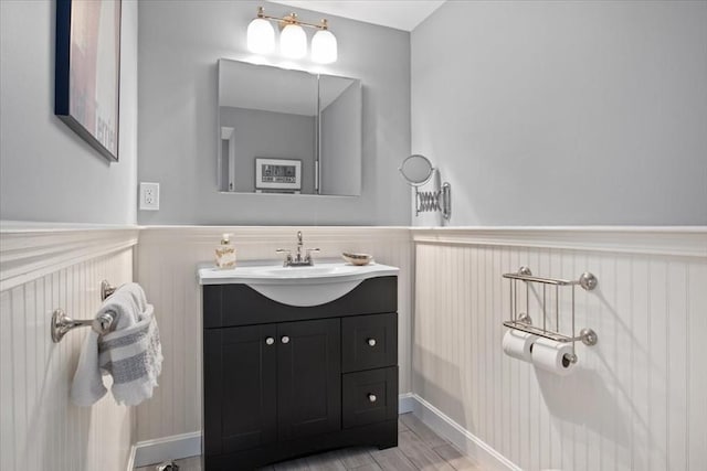 bathroom with wainscoting and vanity