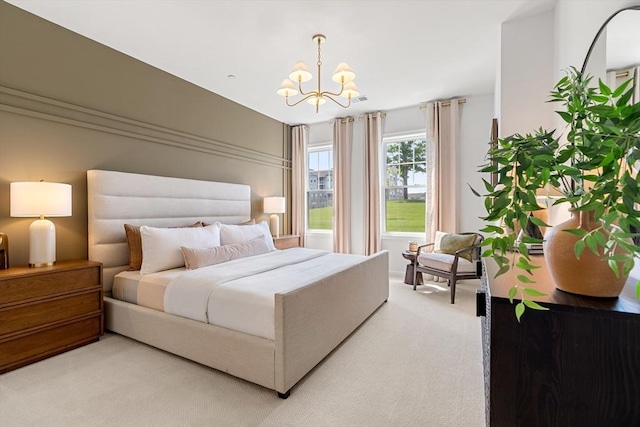 320 Martins Lndg Unit 307, North Reading, MA 01864 - bedroom with light carpet and a chandelier