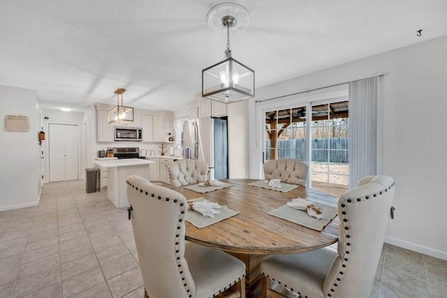 dining area featuring an inviting chandelier