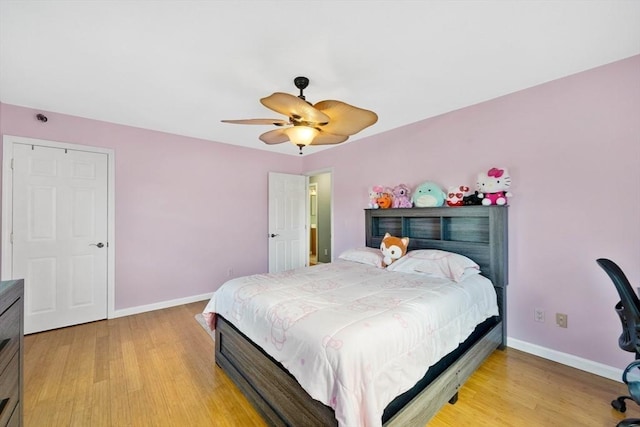 bedroom featuring light hardwood / wood-style flooring and ceiling fan