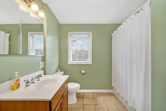 full bathroom with vanity, tile patterned floors, toilet, and shower / tub combo with curtain