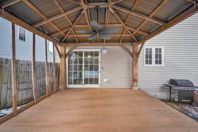 wooden terrace with a gazebo, ceiling fan, and a grill