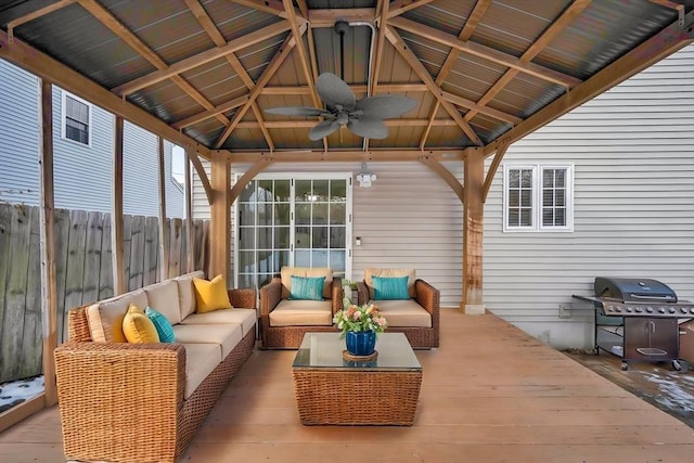 sunroom / solarium with lofted ceiling and ceiling fan