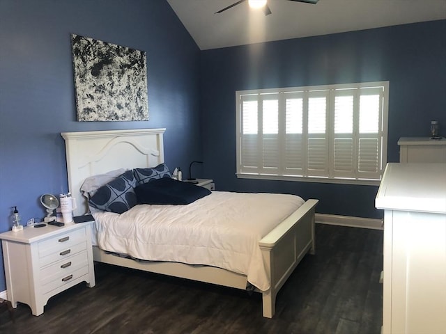 bedroom featuring a ceiling fan, baseboards, vaulted ceiling, and dark wood finished floors