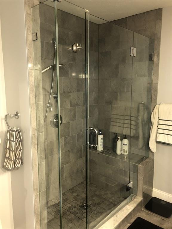 bathroom featuring a shower stall