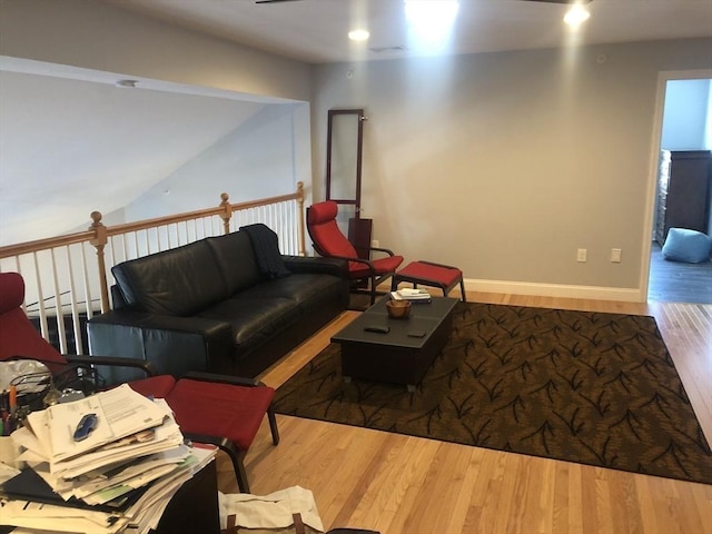 living room featuring baseboards and wood finished floors