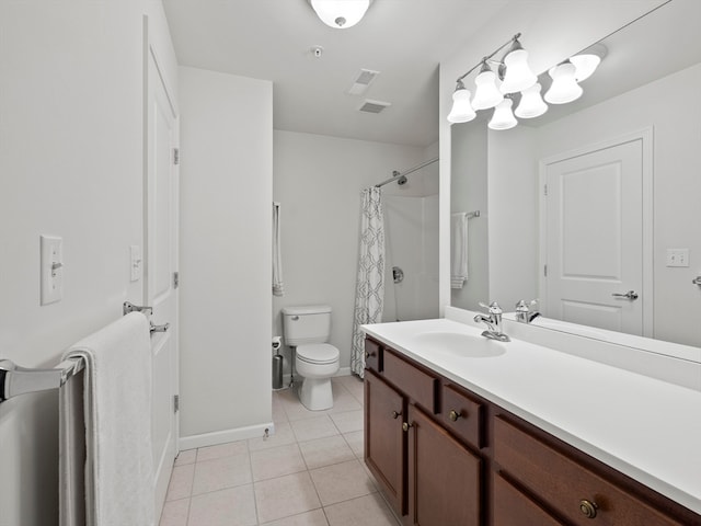 bathroom with tile patterned flooring, vanity, toilet, and curtained shower