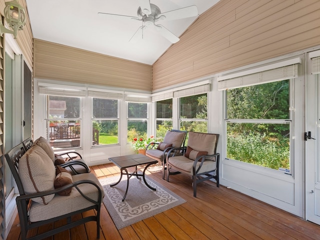 sunroom with lofted ceiling and ceiling fan