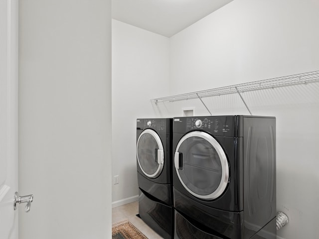 washroom with washer and dryer