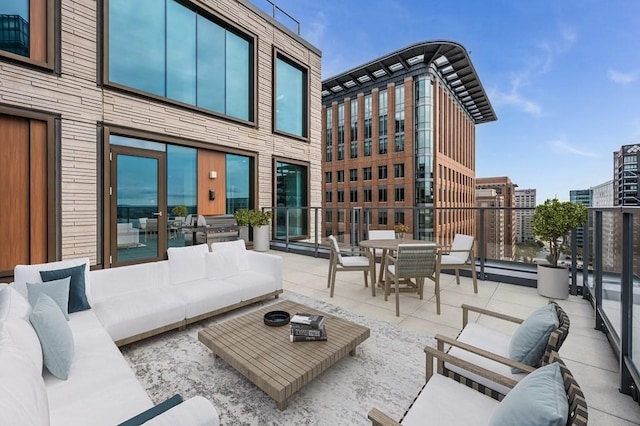 view of patio / terrace with an outdoor living space and a grill