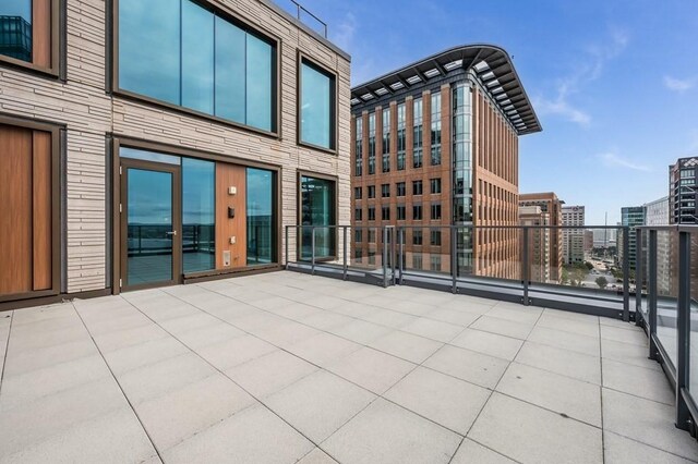 view of patio featuring a balcony