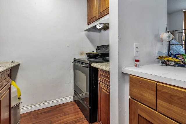 kitchen featuring hardwood / wood-style flooring and black / electric stove