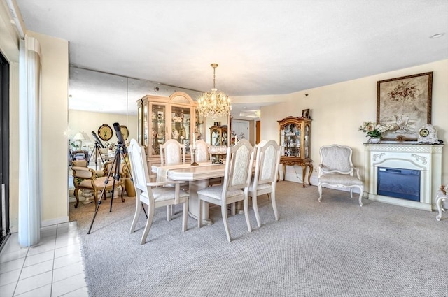 tiled dining space with a chandelier