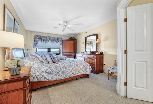 bedroom featuring ceiling fan and light colored carpet