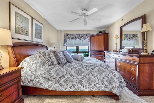 bedroom featuring light carpet and ceiling fan