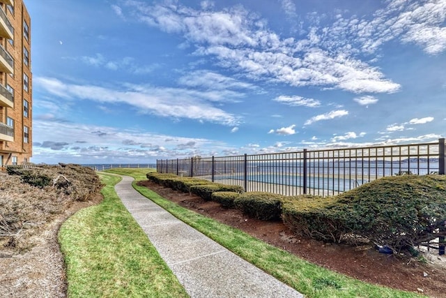 view of home's community with a water view