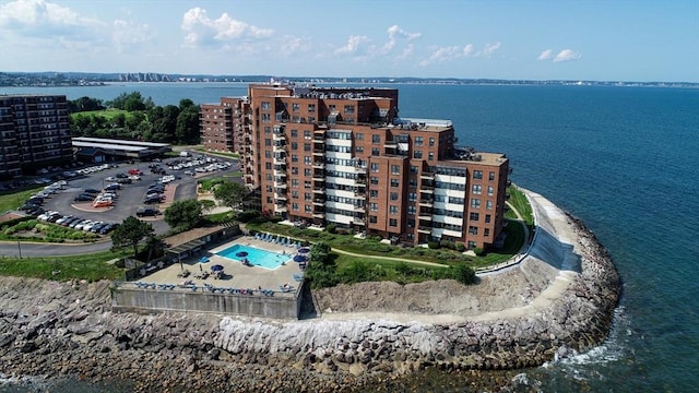 birds eye view of property with a water view