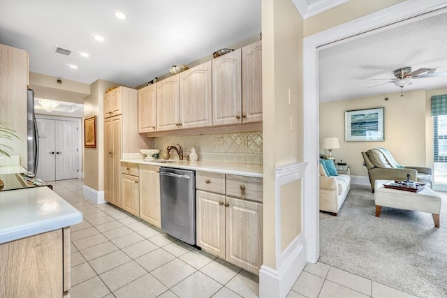 kitchen with ceiling fan, sink, light brown cabinets, light carpet, and appliances with stainless steel finishes