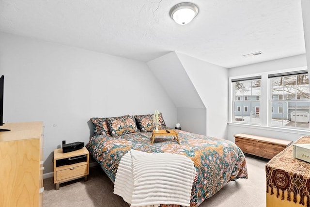 carpeted bedroom featuring vaulted ceiling