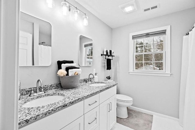 bathroom with vanity and toilet