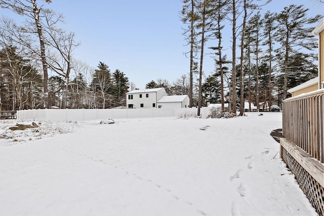 view of yard covered in snow