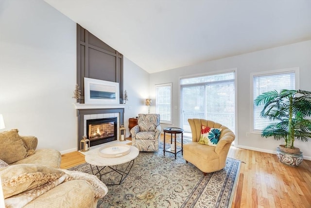 31 Fox Holw, Plymouth, MA 02360 - living area featuring light wood-type flooring, a fireplace, vaulted ceiling, and baseboards