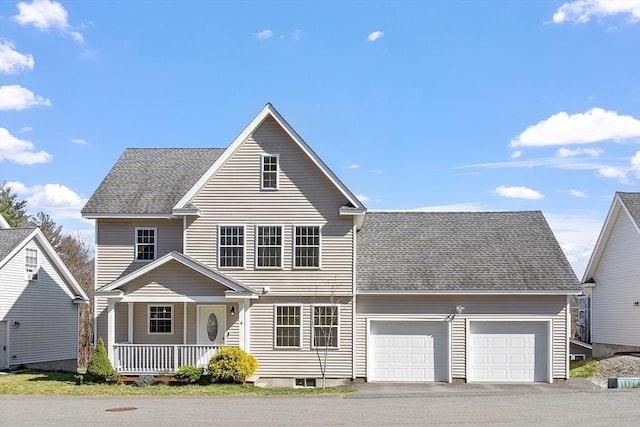 view of front of house with driveway, an attached garage, covered porch, and roof with shingles