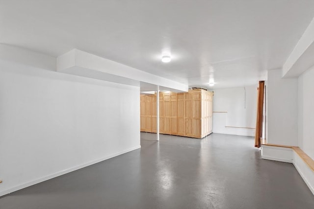 finished basement featuring baseboards