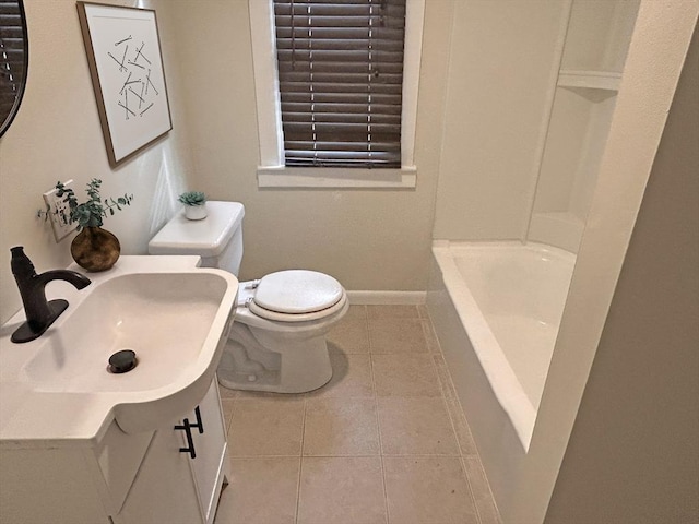 bathroom featuring vanity, toilet, and tile patterned flooring