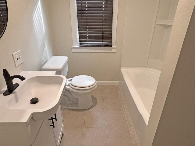 bathroom with toilet, tile patterned flooring, and vanity