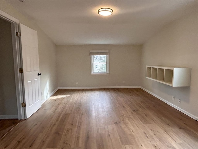 spare room with light hardwood / wood-style flooring