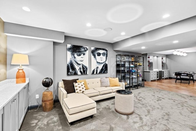 living area featuring a bar, carpet, recessed lighting, and baseboards