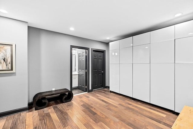 interior space featuring recessed lighting and wood finished floors