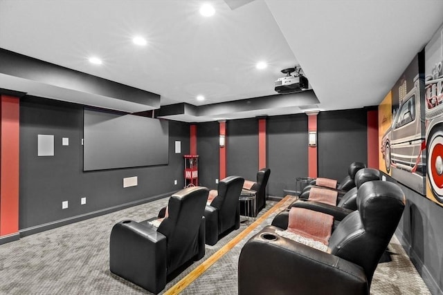 carpeted cinema room with recessed lighting and baseboards