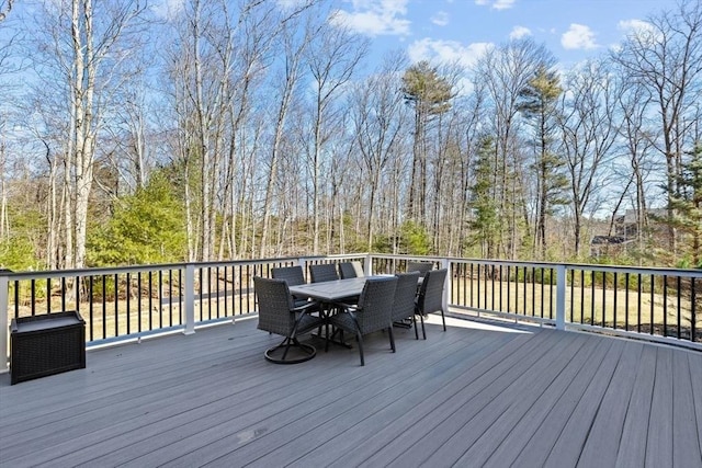 wooden terrace featuring outdoor dining space