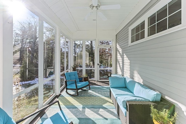 sunroom with ceiling fan and plenty of natural light