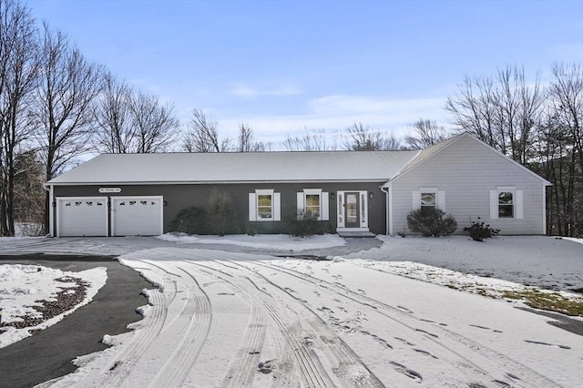 ranch-style house featuring a garage