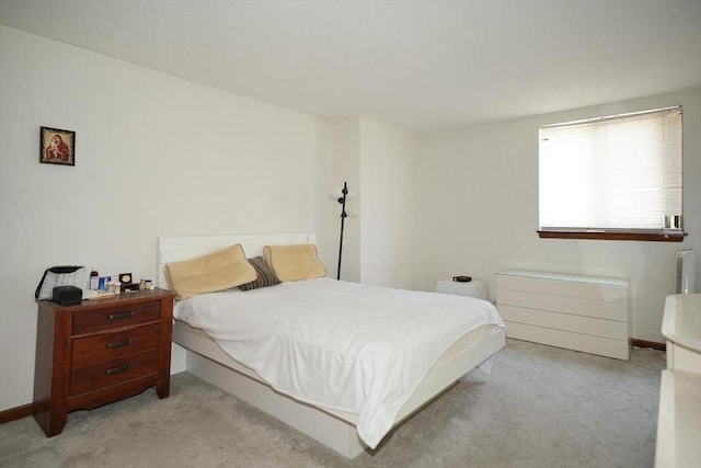 bedroom featuring light colored carpet