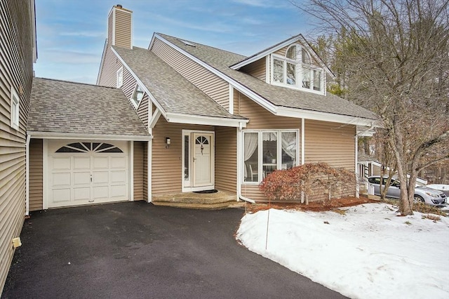 view of front of property with a garage